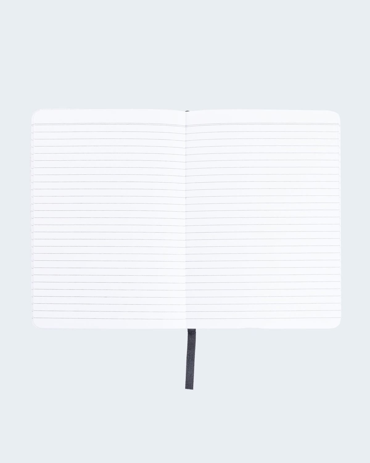 Open spread of GitHub notebook with a black ribbon page marker on a light gray background