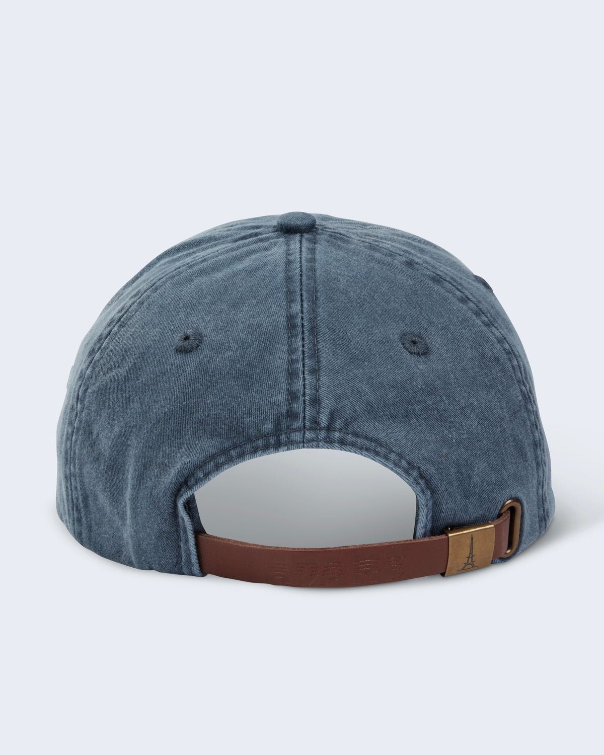 Back view of navy Invertocat 2.0 cap showing brown adjustable leather strap and hook-and-loop grommet closure.