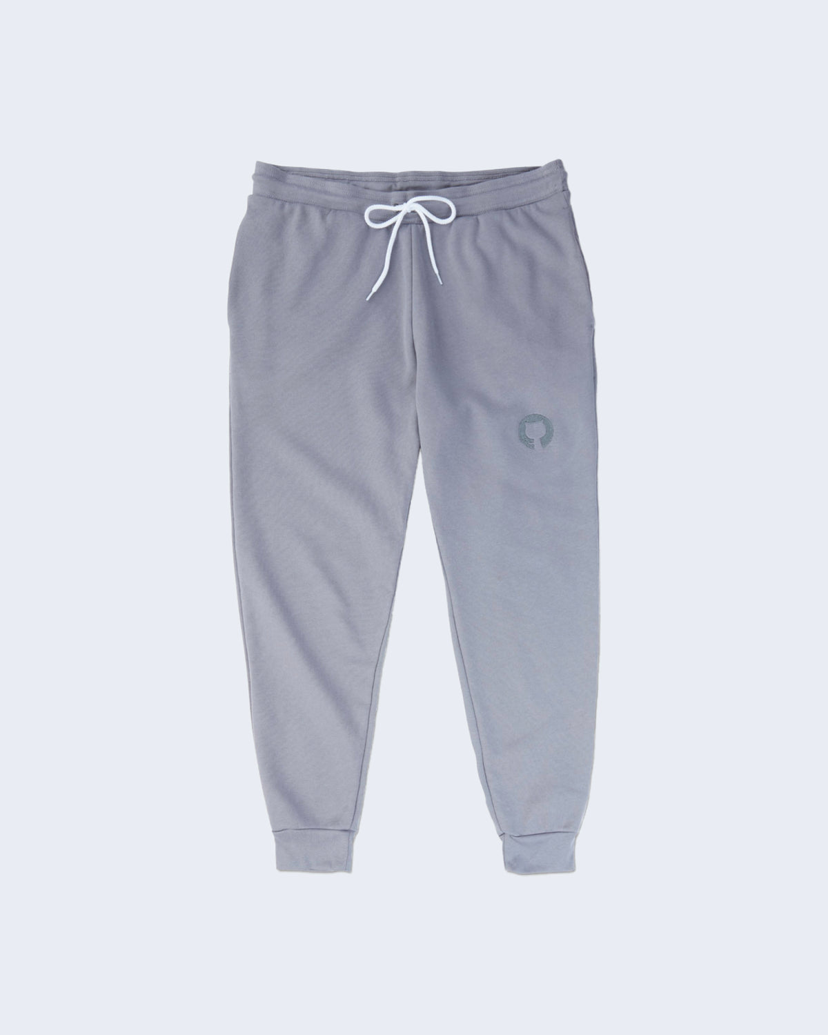 Gray joggers with white drawstring waistband, side pockets, cuffed ankles, and featuring gray Invertocat logo embroidered on the left thigh.