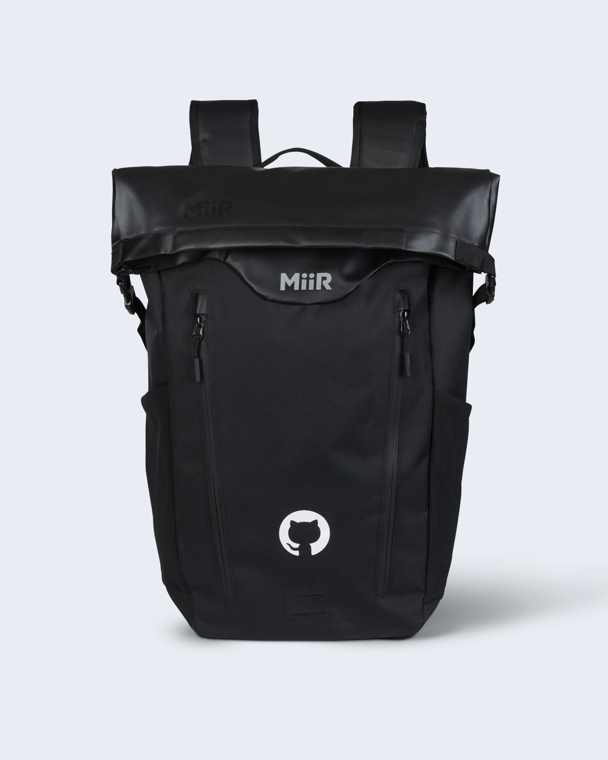 MiiR® Olympus 25 L laptop backpack in black, featuring the white Invertocat logo centered on the roll-top flap, side mesh pockets, and dual front zippered compartments.