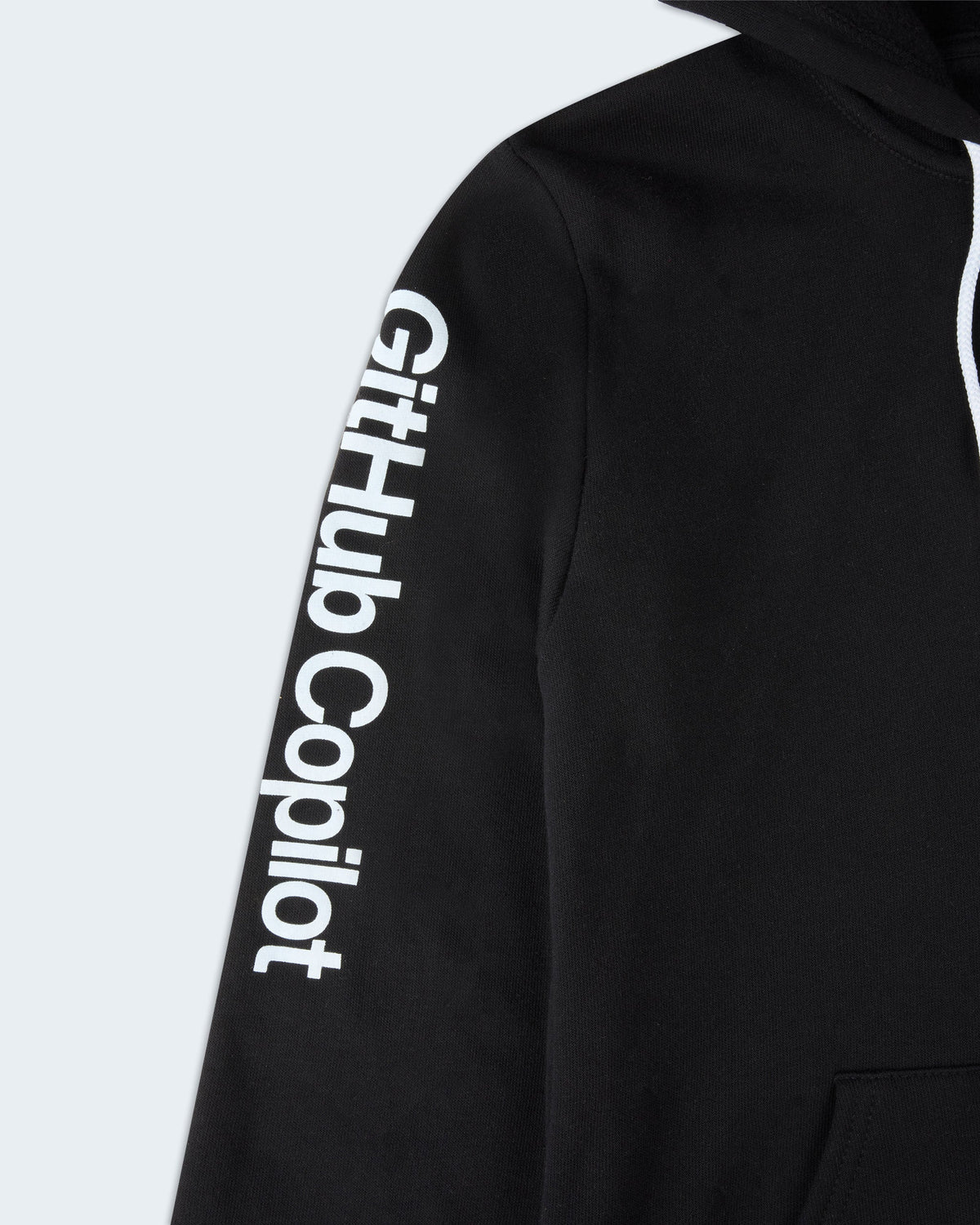 Close-up view of sleeve on GitHub Copilot hoodie with white “GitHub Copilot” text printed