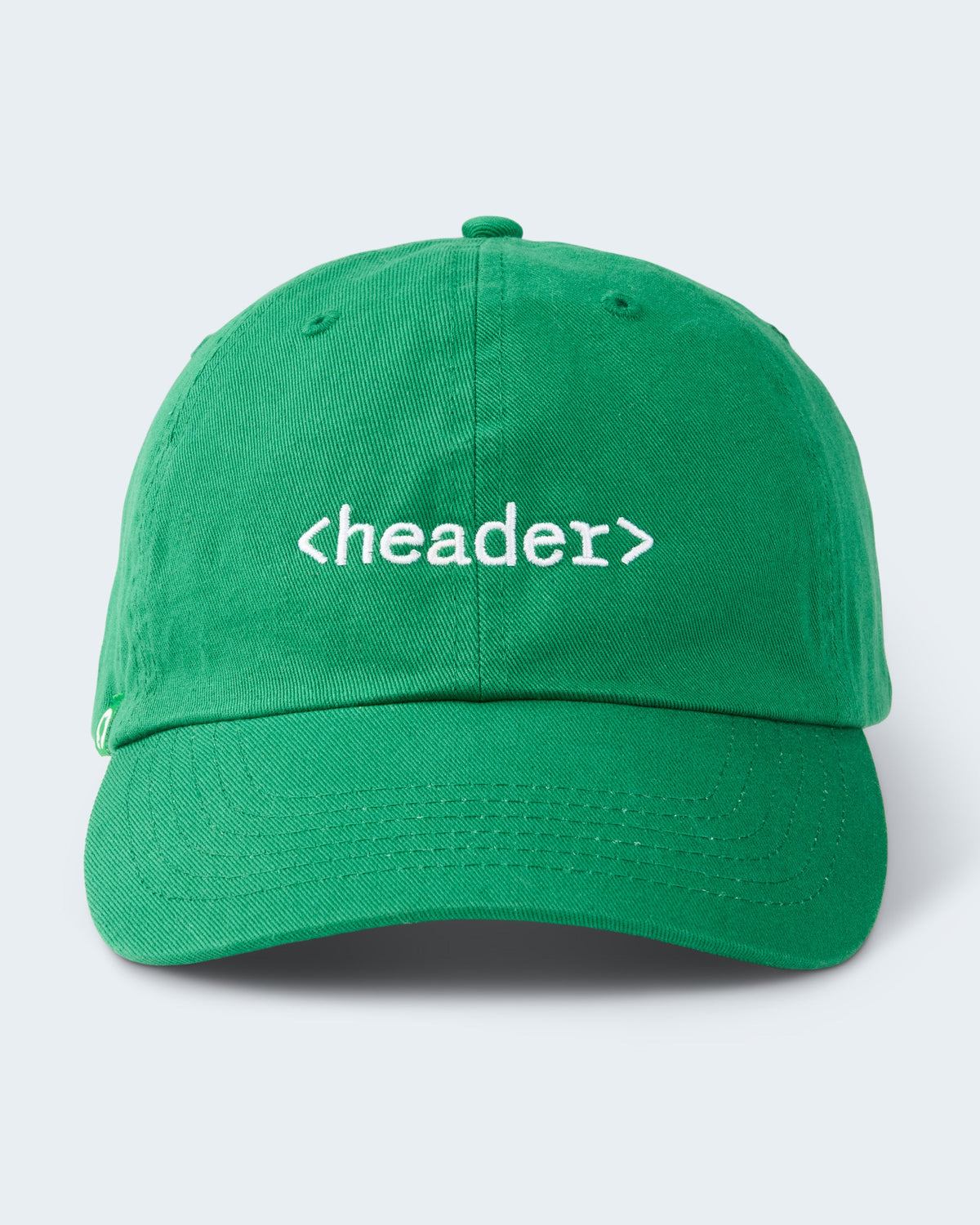 Green six-panel unstructured cap with <header> embroidered in white text on the front