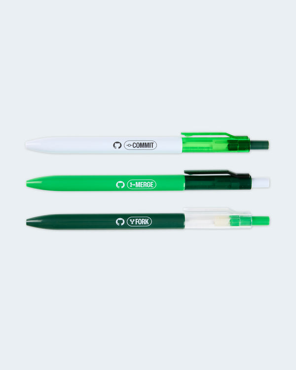 Three GitHub-themed pens in white, light green, and dark green labeled Commit, Merge, and Fork