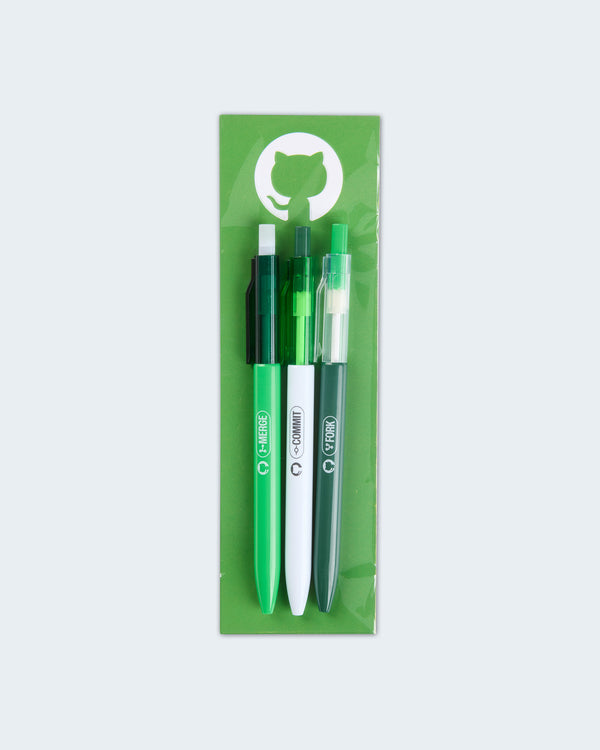 Set of three GitHub-themed pens in white, light green, and dark green with Commit, Merge, and Fork labels in packaging