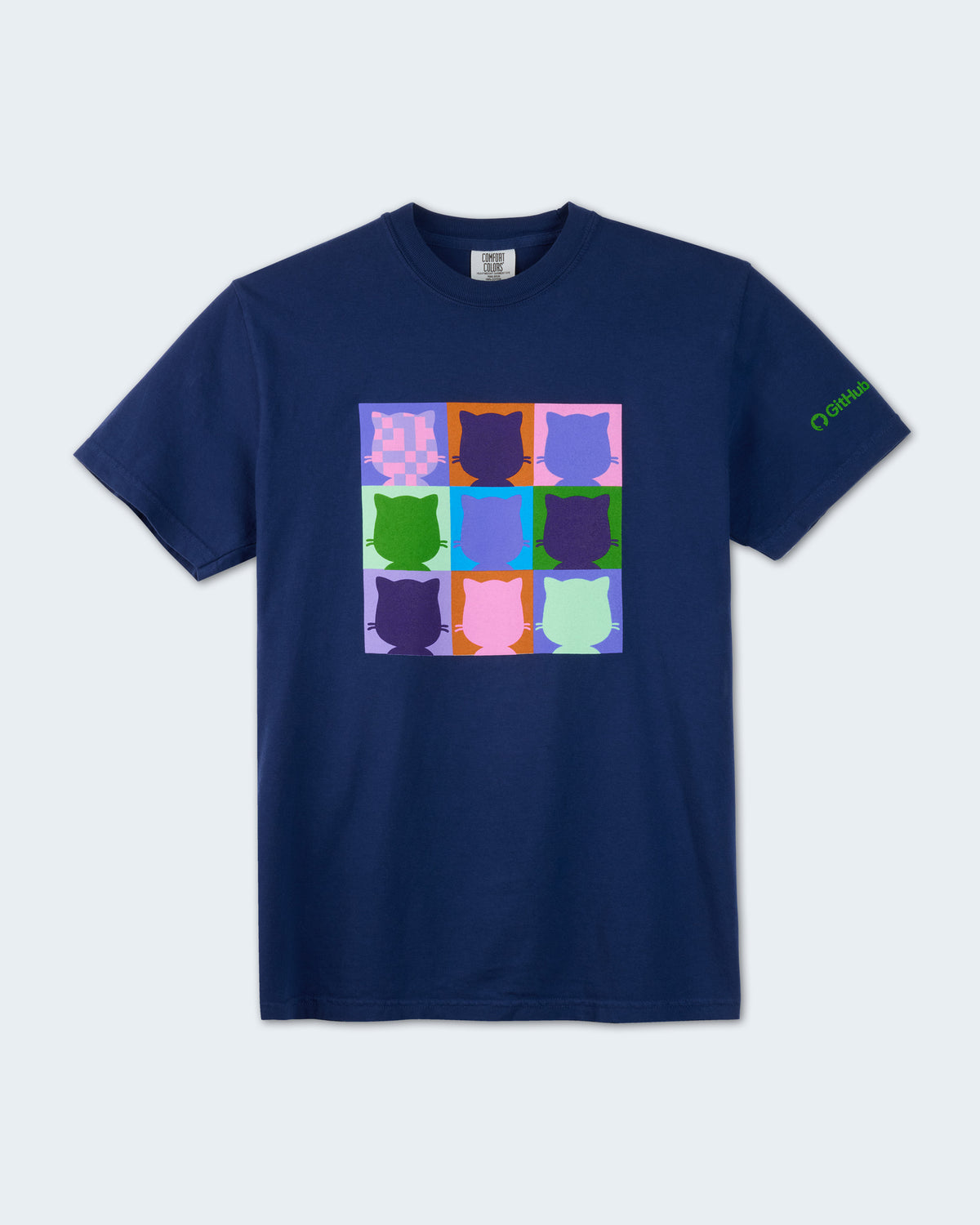 Navy blue short-sleeve t-shirt featuring a colorful nine-panel grid of Mona head silhouettes in assorted purple, blue, green, pink, and orange colors on the front chest. A small green GitHub logo graphic is printed on the left sleeve.