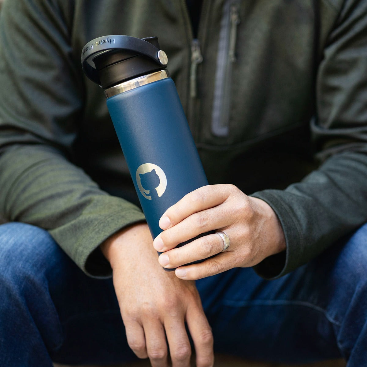 Photo of a person holding the Invertocat Hydroflask Waterbottle.