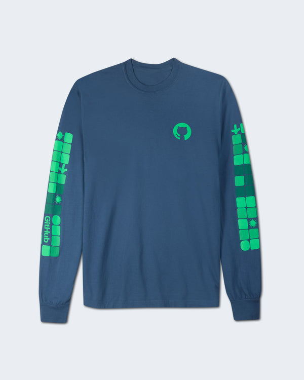Front view of a midnight blue long-sleeve shirt featuring the green GitHub logo on the left chest and green geometric block patterns with icons down both sleeves.