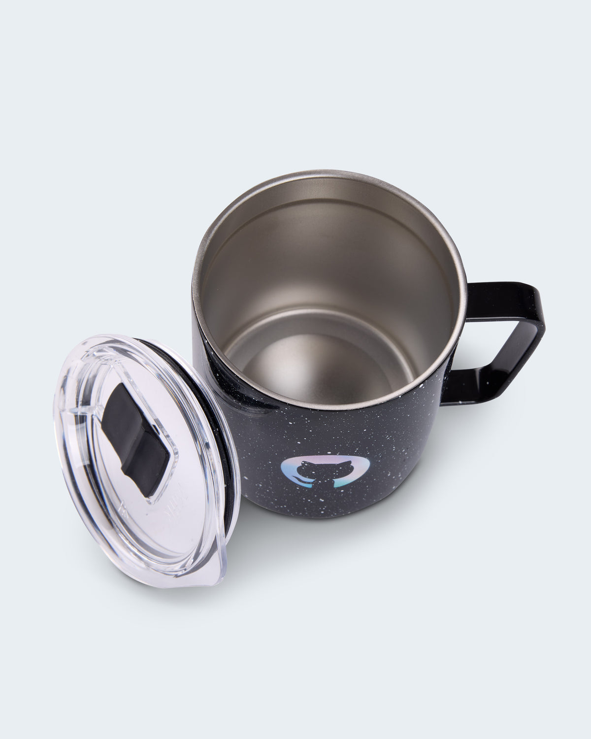 Top view of Black speckled GitHub camp mug with holographic Octocat logo shown open with detachable clear lid beside it.