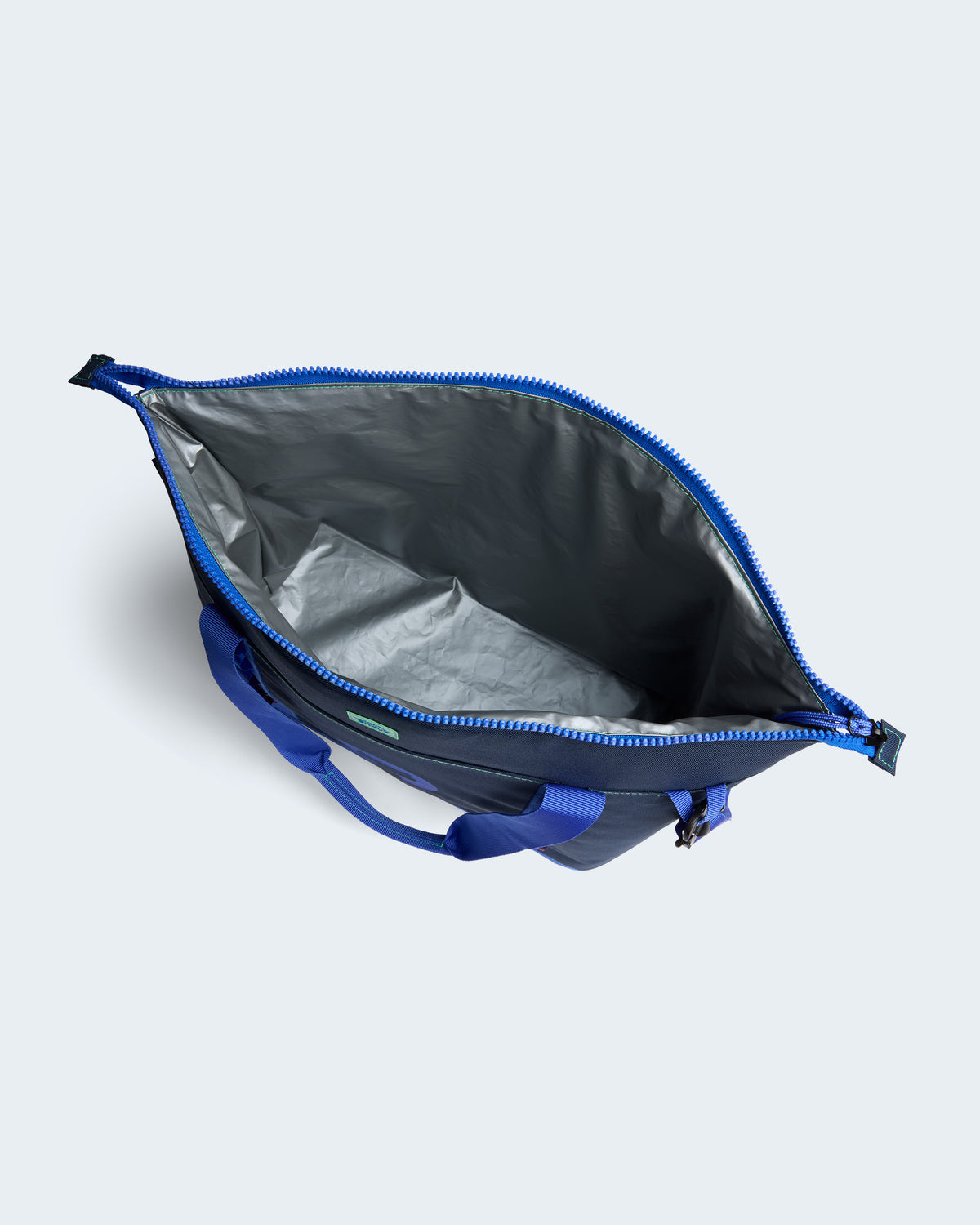 Tote bag inside view with a large, insulated main compartment.