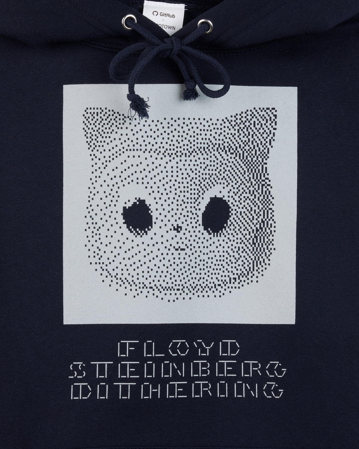 Black hoodie with a white square featuring a Mona black dot pattern and text.