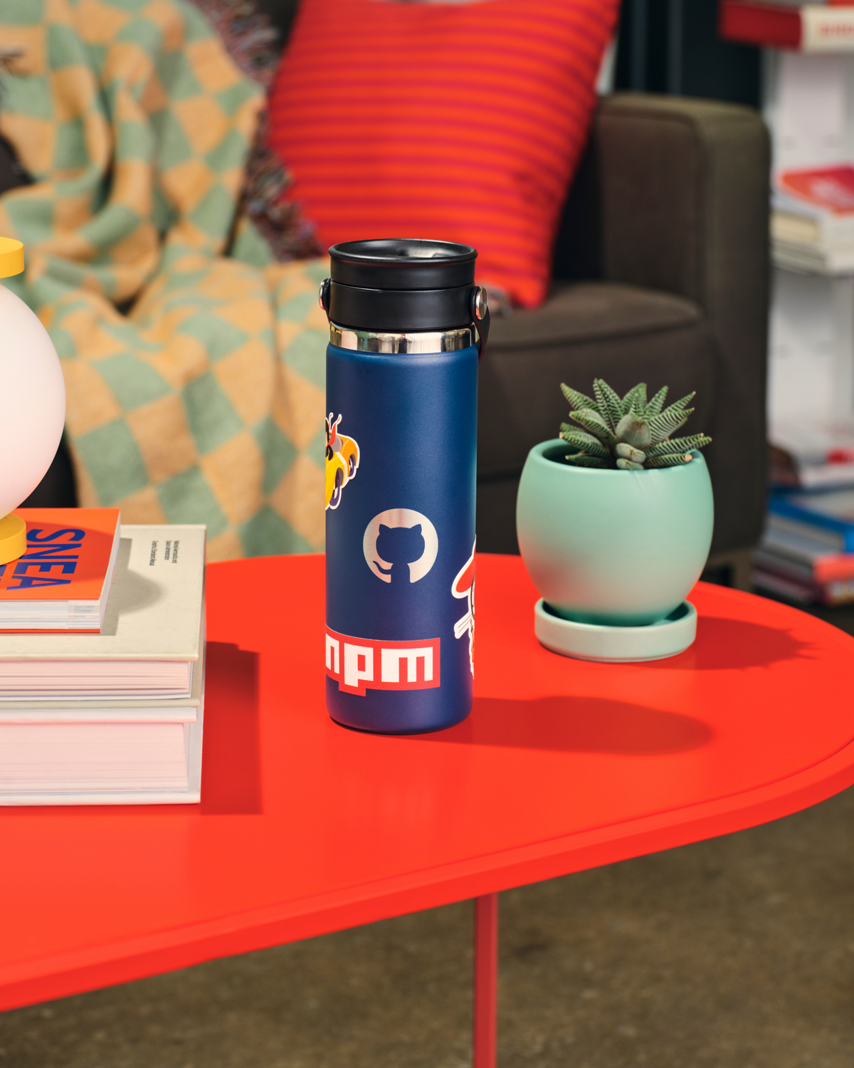 Photo of the Invertocat Hydroflask Waterbottle on a living room coffee table.